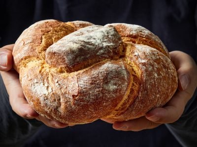 freshly baked bread in hands